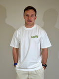 Model wearing white limited edition Pause oversized t-shirt, front view
